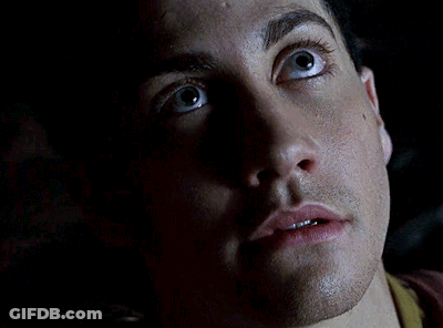 A Close Up Of A Man 'S Face With A Yellow X In The Background GIF
