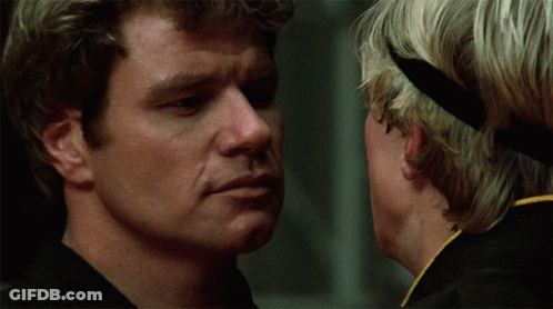 A Close Up Of A Man 'S Face With Another Man Behind Him GIF