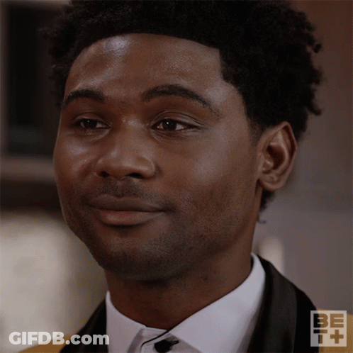 A Close Up Of A Man 'S Face With Be + Written On The Bottom GIF