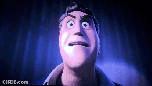 A Close Up Of A Man 'S Face With Big Eyes GIF