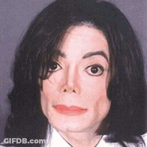 A Close Up Of A Man 'S Face With Black Hair GIF