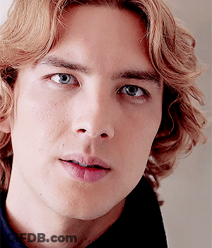 A Close Up Of A Man 'S Face With Blonde Hair GIF