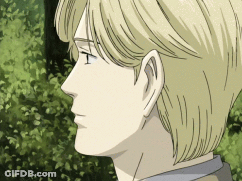 A Close Up Of A Man 'S Face With Blonde Hair And A Green Background GIF