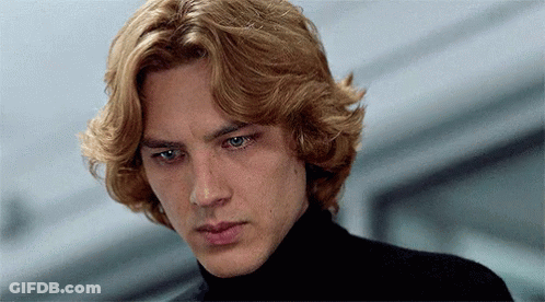 A Close Up Of A Man 'S Face With Blonde Hair And Blue Eyes GIF