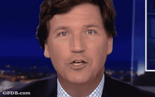 A Close Up Of A Man 'S Face With Blue Eyes GIF