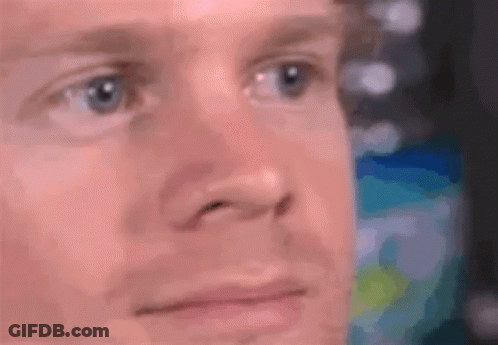 A Close Up Of A Man 'S Face With Blue Eyes And A Blurred Background . GIF
