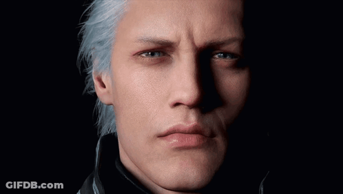 A Close Up Of A Man 'S Face With Blue Eyes GIF