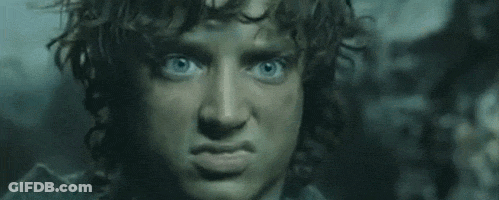 A Close Up Of A Man 'S Face With Blue Eyes Making A Face . GIF