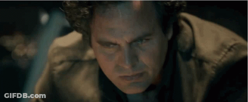 A Close Up Of A Man 'S Face With Blue Eyes GIF