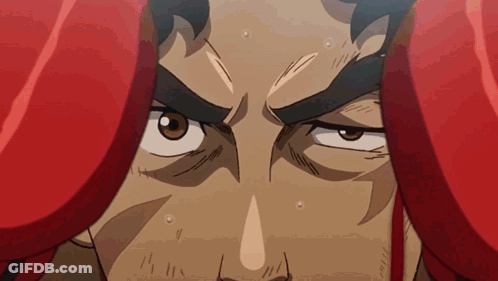 A Close Up Of A Man 'S Face With Boxing Gloves On GIF