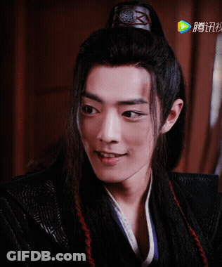 A Close Up Of A Man 'S Face With Chinese Writing On The Bottom Left GIF