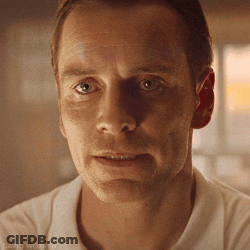 A Close Up Of A Man 'S Face With David Worren Written On The Bottom Right GIF