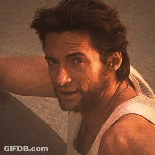 A Close Up Of A Man 'S Face With David Worren Written On The Bottom Right GIF