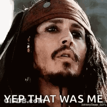 A Close Up Of A Man 'S Face With Dreadlocks And A Bandana On His Head . GIF