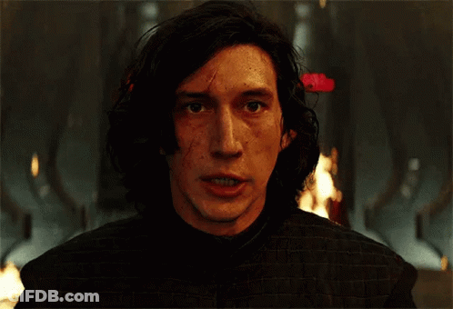 A Close Up Of A Man 'S Face With Fire In The Background . GIF
