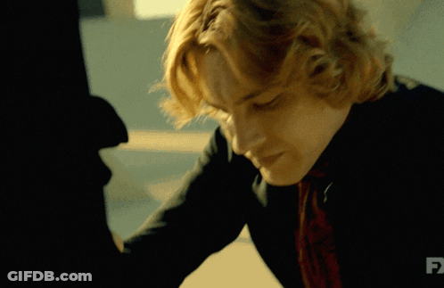 A Close Up Of A Man 'S Face With Fx Written On The Bottom GIF