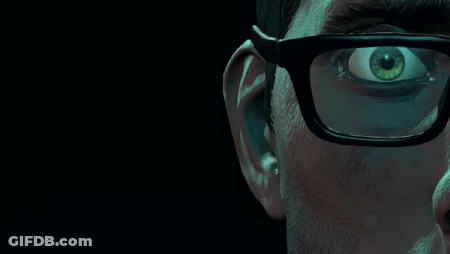 A Close Up Of A Man 'S Face With Glasses And A Green Eye GIF