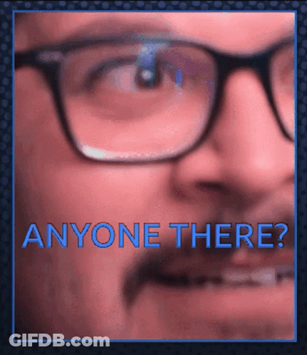 A Close Up Of A Man 'S Face With Glasses And The Words " Anyone There " GIF