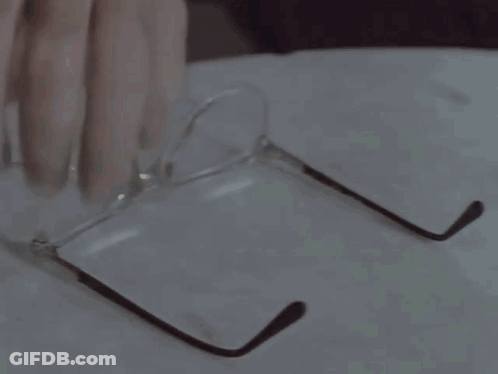 A Close Up Of A Man 'S Face With Glasses GIF