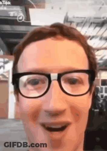 A Close Up Of A Man 'S Face With Glasses On GIF