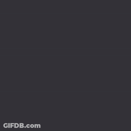 A Close Up Of A Man 'S Face With Glasses Surrounded By Broken Pieces Of Glass GIF