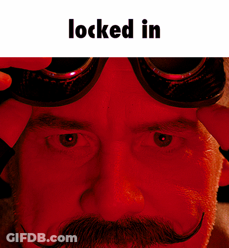 A Close Up Of A Man 'S Face With Goggles On And The Words Locked In Above Him GIF