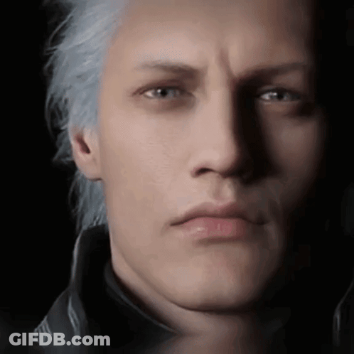 A Close Up Of A Man 'S Face With Gray Hair And A Black Jacket . GIF