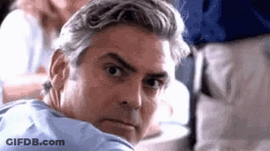 A Close Up Of A Man 'S Face With Gray Hair GIF