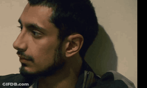 A Close Up Of A Man 'S Face With His Eyes Closed GIF