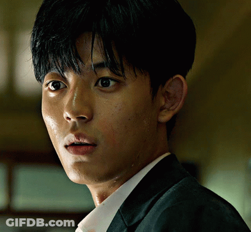 A Close Up Of A Man 'S Face With His Eyes Closed GIF