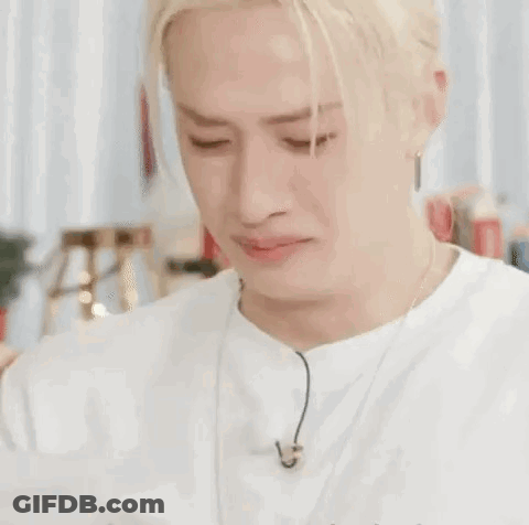 A Close Up Of A Man 'S Face With His Eyes Closed . GIF