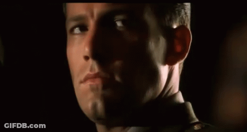A Close Up Of A Man 'S Face With His Eyes Closed GIF