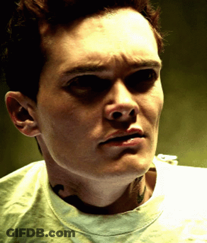 A Close Up Of A Man 'S Face With His Eyes Closed GIF