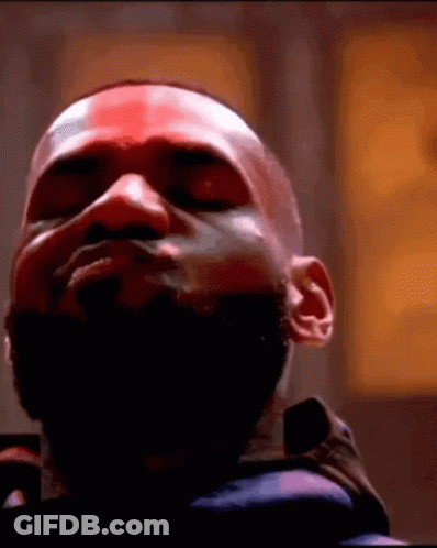 A Close Up Of A Man 'S Face With His Eyes Closed And A Beard . GIF
