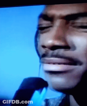A Close Up Of A Man 'S Face With His Eyes Closed And A Mustache GIF
