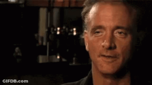 A Close Up Of A Man 'S Face With His Eyes Closed And A Nose . GIF