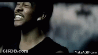 A Close Up Of A Man 'S Face With His Eyes Closed And A Smile On His Face . GIF