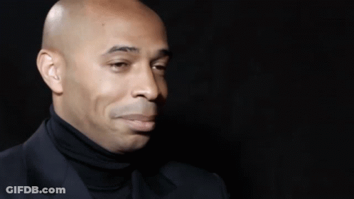 A Close Up Of A Man 'S Face With His Eyes Closed And A Smile On His Face . GIF