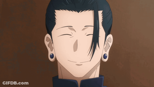 A Close Up Of A Man 'S Face With His Eyes Closed And Blue Earrings GIF
