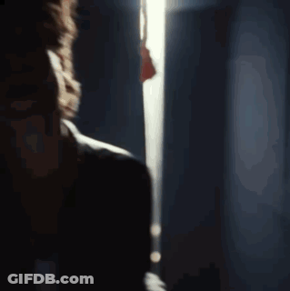 A Close Up Of A Man 'S Face With His Eyes Closed And His Mouth Open GIF