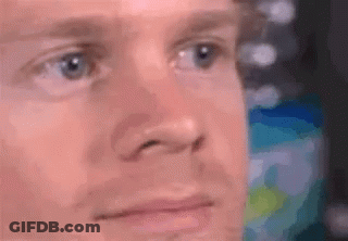A Close Up Of A Man 'S Face With His Eyes Closed And His Mouth Open . GIF
