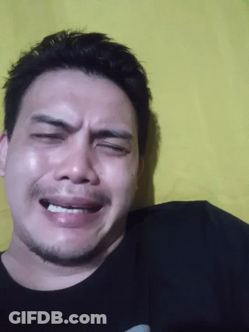 A Close Up Of A Man 'S Face With His Eyes Closed And His Mouth Open GIF