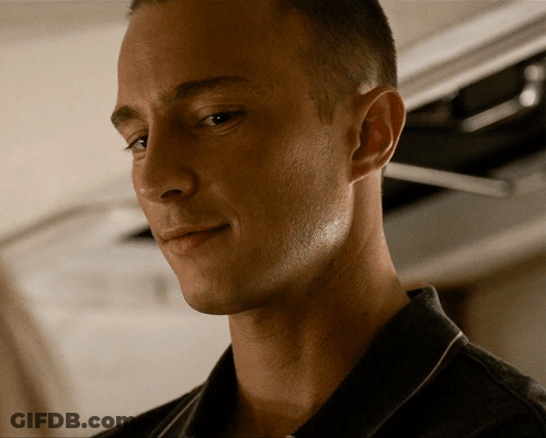 A Close Up Of A Man 'S Face With His Eyes Closed And His Mouth Open GIF
