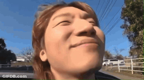 A Close Up Of A Man 'S Face With His Eyes Closed And His Mouth Open GIF