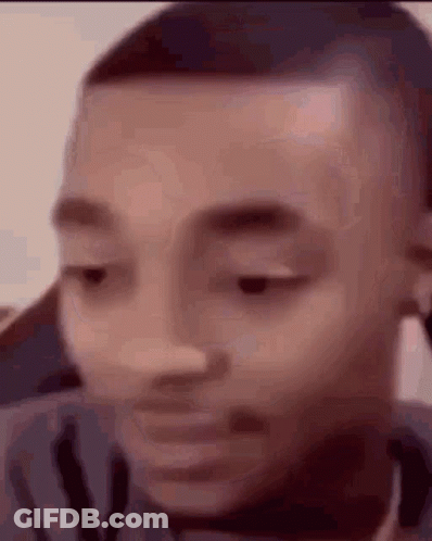 A Close Up Of A Man 'S Face With His Eyes Closed And His Mouth Open . GIF