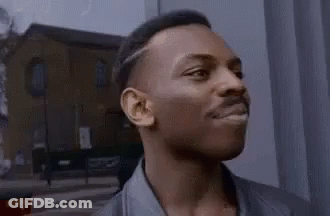 A Close Up Of A Man 'S Face With His Eyes Closed And His Mouth Open . GIF