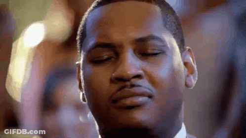 A Close Up Of A Man 'S Face With His Eyes Closed And His Mouth Open . GIF