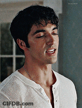 A Close Up Of A Man 'S Face With His Eyes Closed And His Mouth Open . GIF