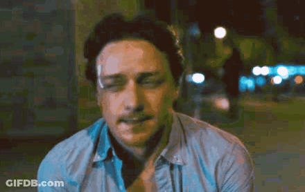 A Close Up Of A Man 'S Face With His Eyes Closed And His Mouth Open GIF