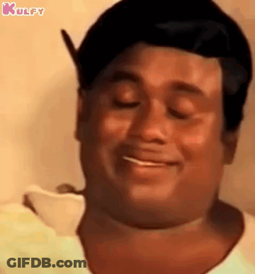 A Close Up Of A Man 'S Face With His Eyes Closed And Smiling . GIF
